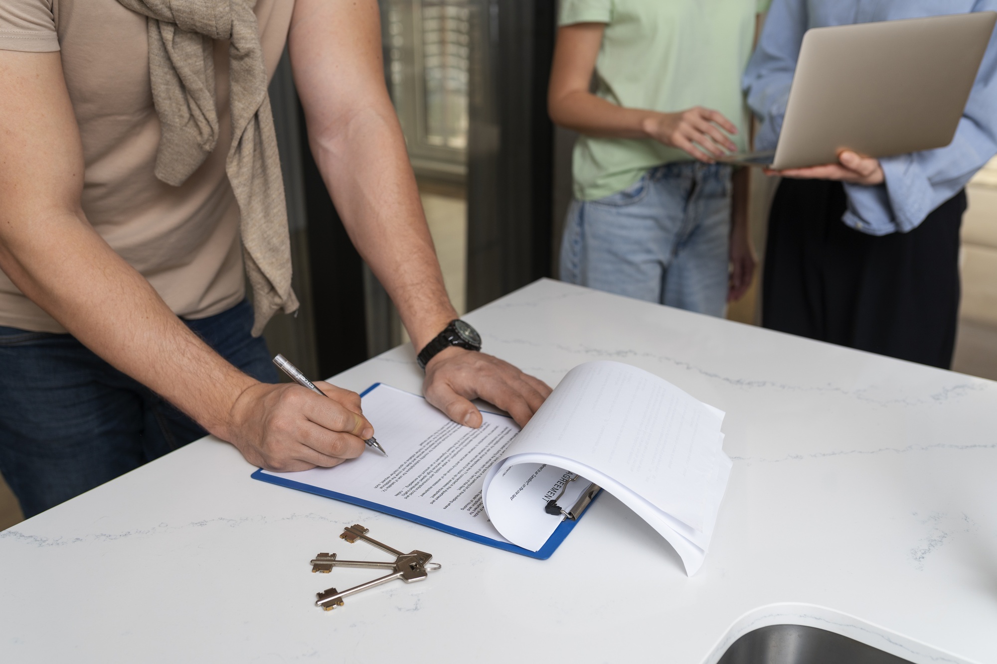 side-view-buyer-signing-document